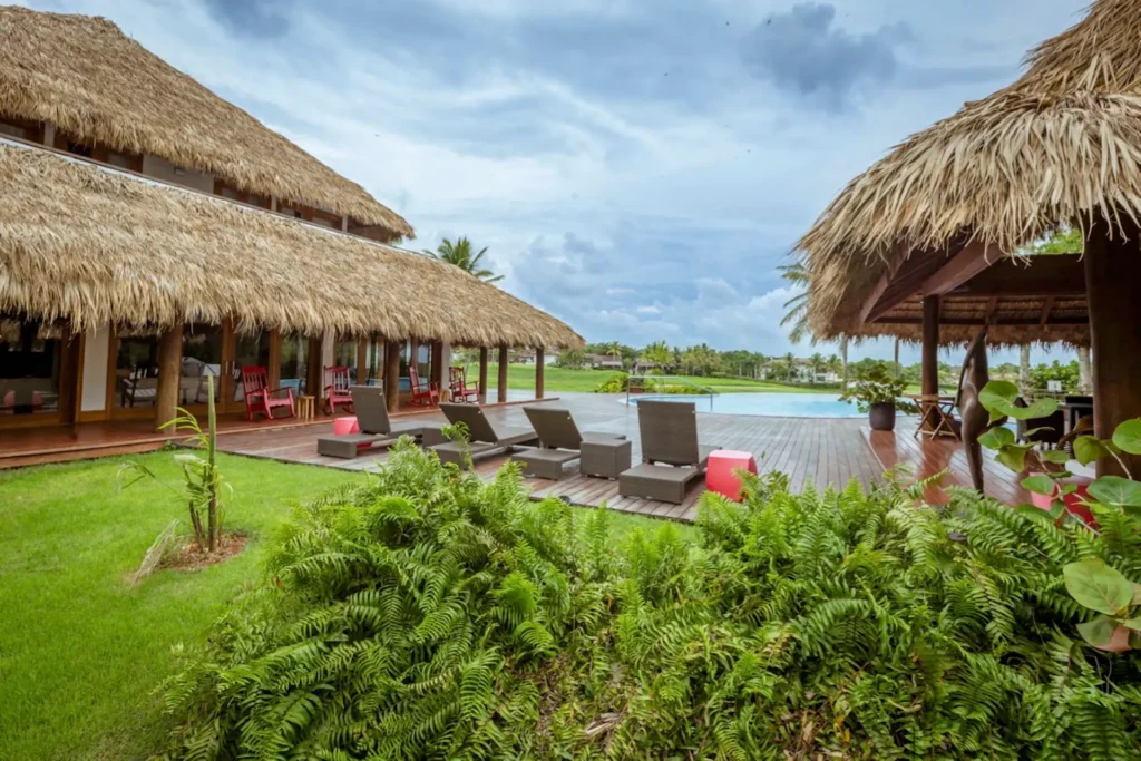 Rio Arriba villa exterior with tropical gardens — Casa de Campo neighborhood guides