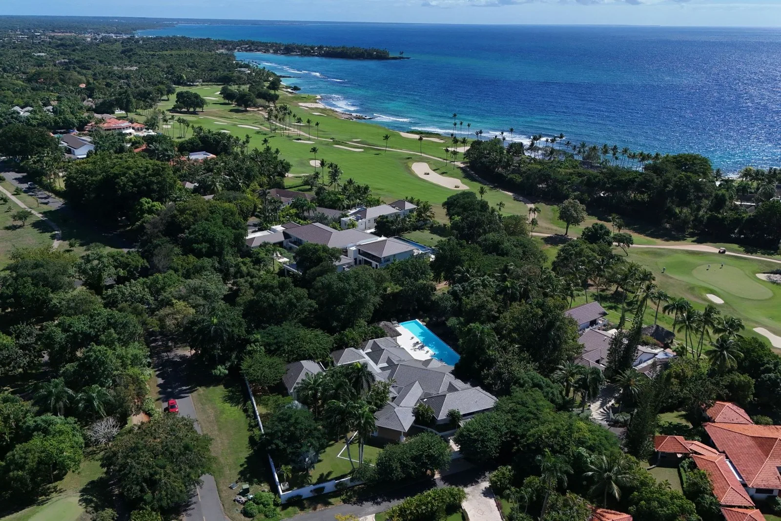 Aerial view of the villa with the golf course and sea beyond, Cacique 26, Cacique, Casa de Campo®