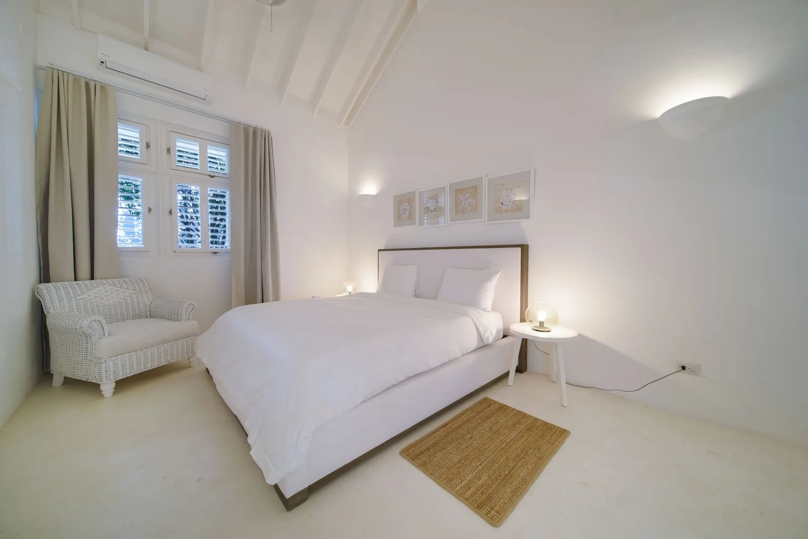 Bedroom with armchair and shuttered windows, Cacique 26, Cacique, Casa de Campo®