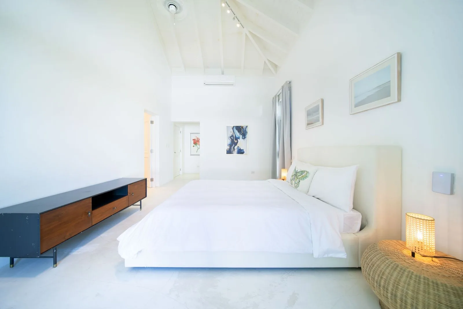 Bedroom with low wooden console and artwork, Cacique 26, Cacique, Casa de Campo®