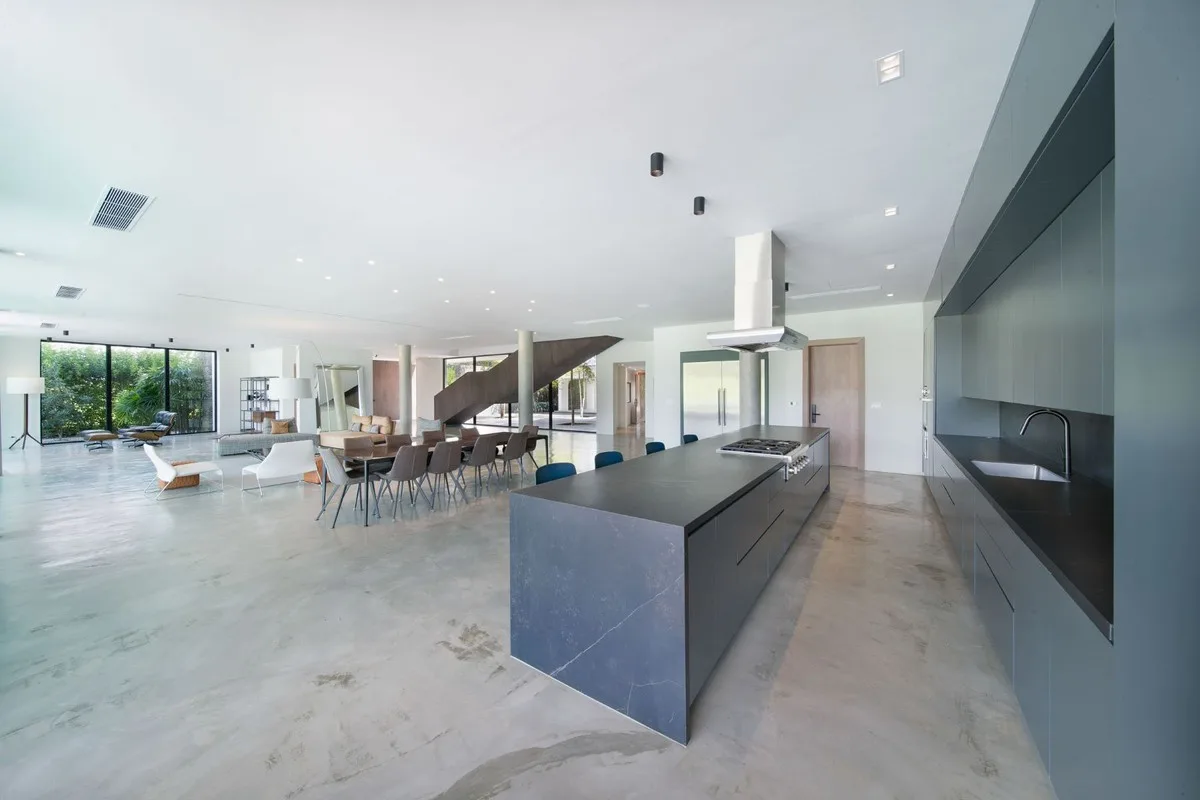 Kitchen with dark island and open living space, El Valle 6, El Valle, Casa de Campo®