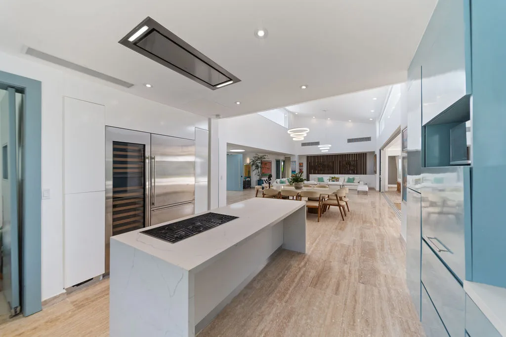 Kitchen with island cooktop and open living beyond, La Vereda 26, La Vereda, Casa de Campo®