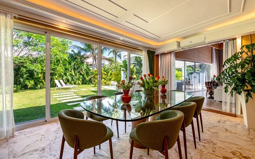 Dining table beside sliding doors to the garden, Las Cañas I 37, Las Cañas, Casa de Campo®