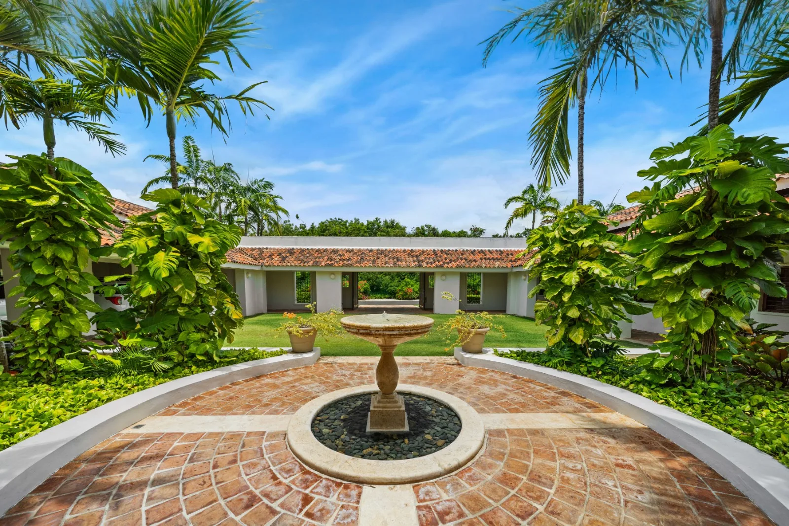 Fountain courtyard framed by palms, Punta Aguila 52, Punta Aguila, Casa de Campo®