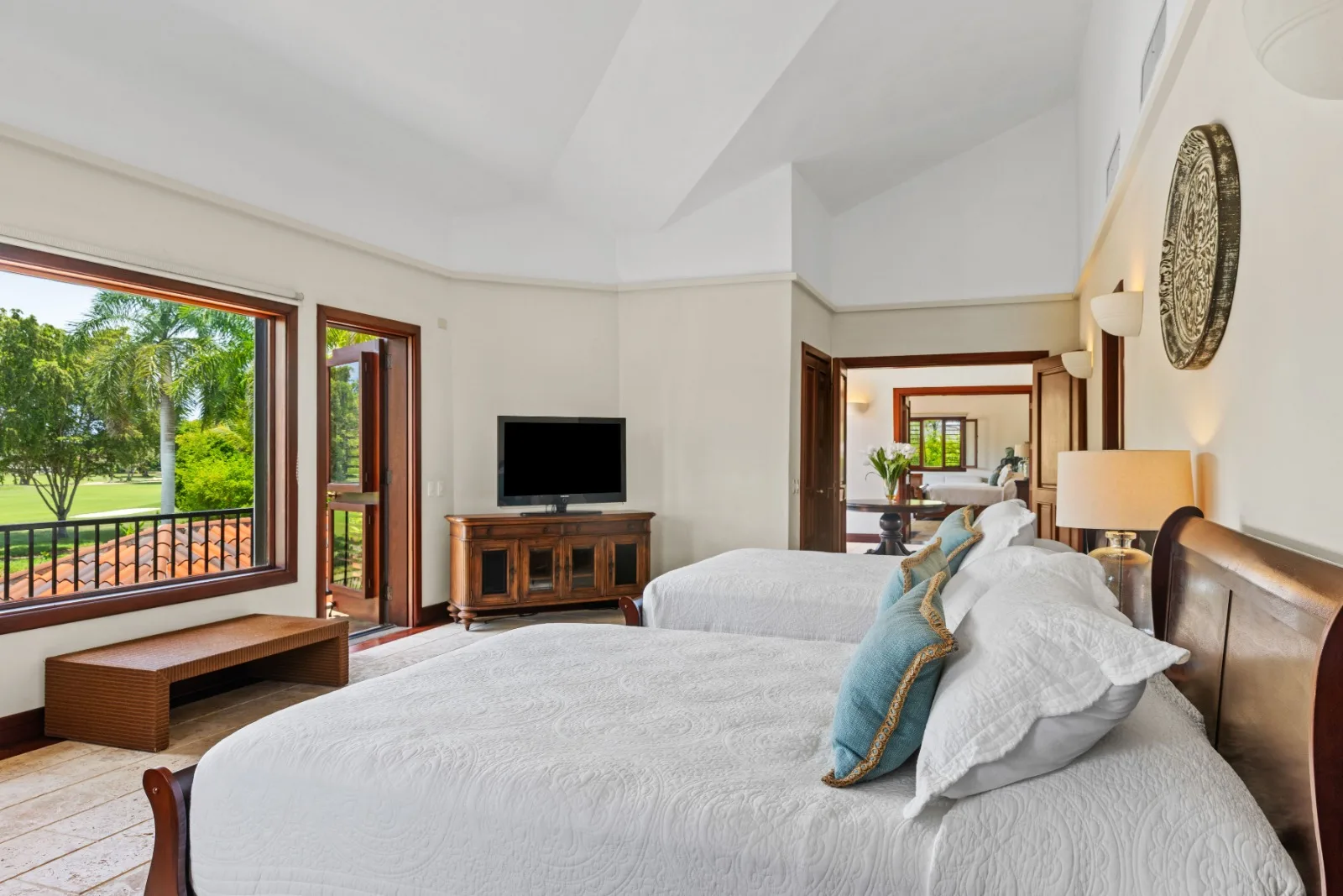 Bedroom with wooden bed and garden views, Punta Aguila 52, Punta Aguila, Casa de Campo®