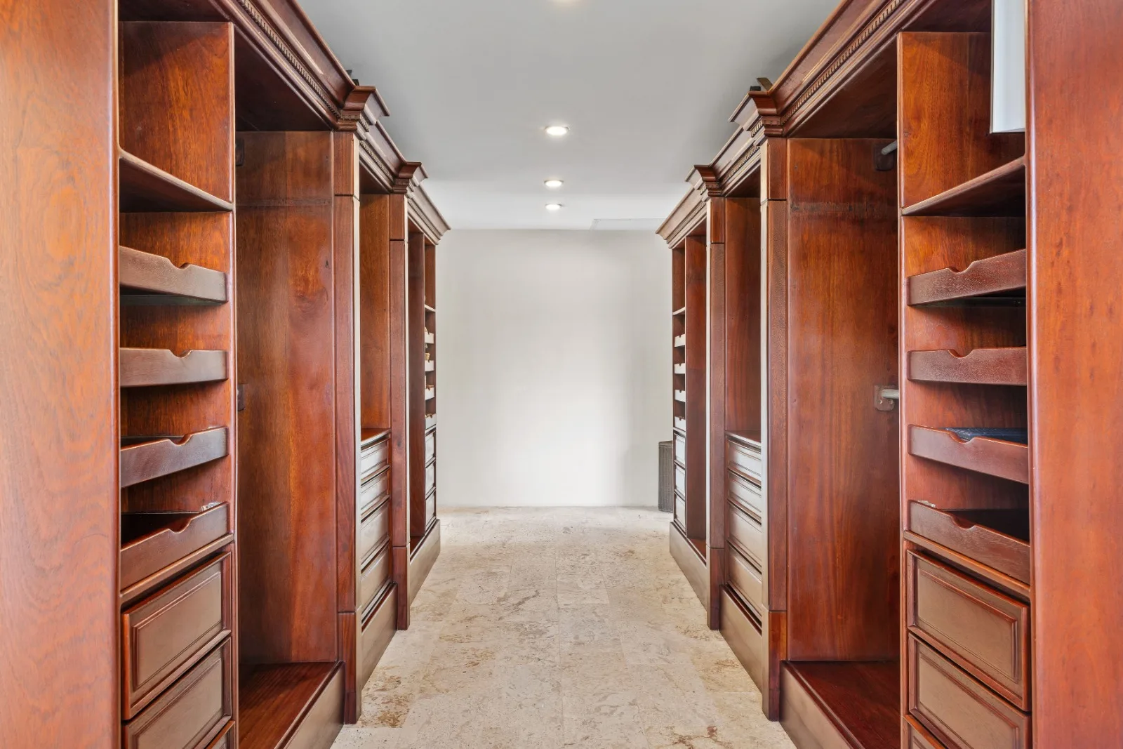 Walk-in closet with built-in wooden cabinetry, Punta Aguila 52, Punta Aguila, Casa de Campo®