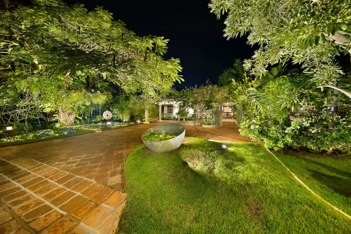 Garden pathway and lawn lit at night, Rancho Arriba 30, Rancho Arriba, Casa de Campo®