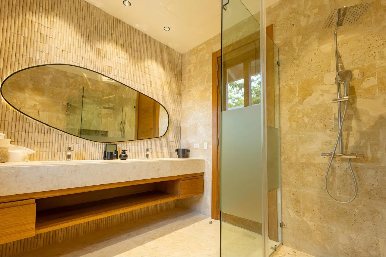 Bathroom with stone vanity and glass shower, Barranca Este 14, Barranca Este, Casa de Campo®